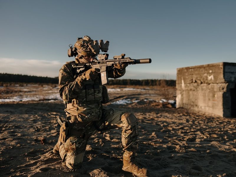 Soldier taking aim during a live field training exercise