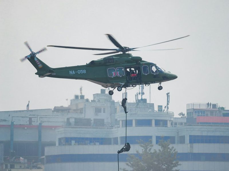 Quick-response drill, soldiers rappelling from a helicopter